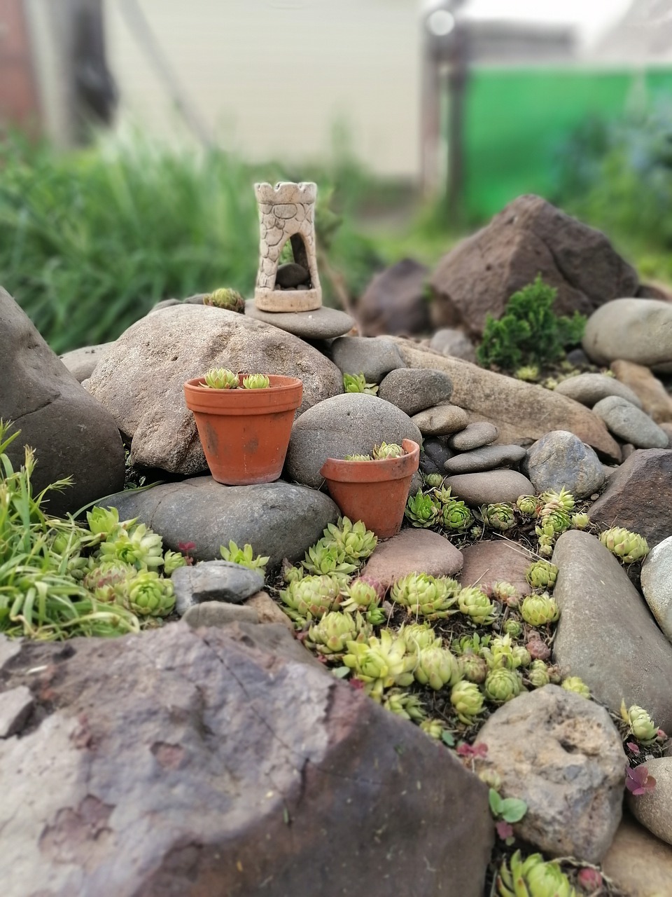 What materials are used to make a rockery?